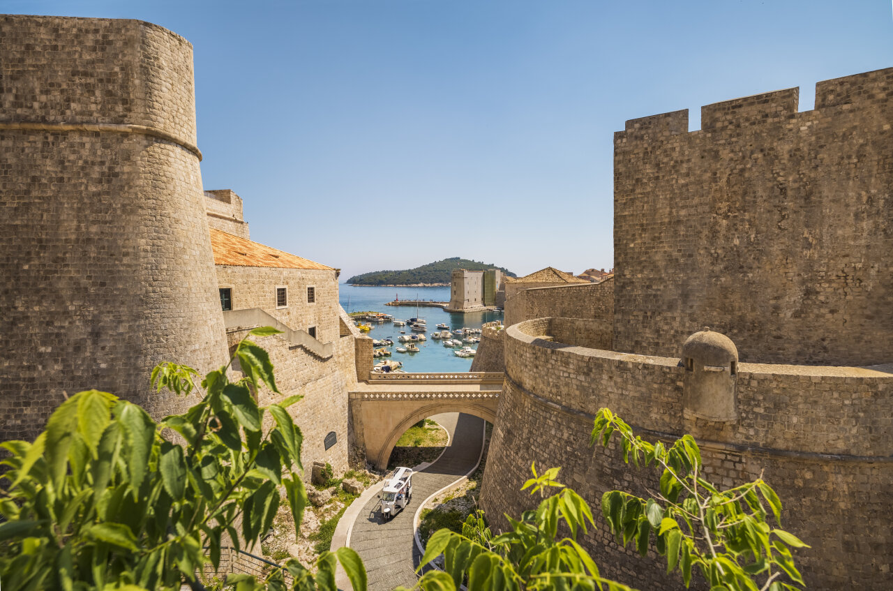 View from Dubrovnik’s city walls toward the old port and Lokrum island View from Dubrovnik’s city walls toward the old port and Lokrum island