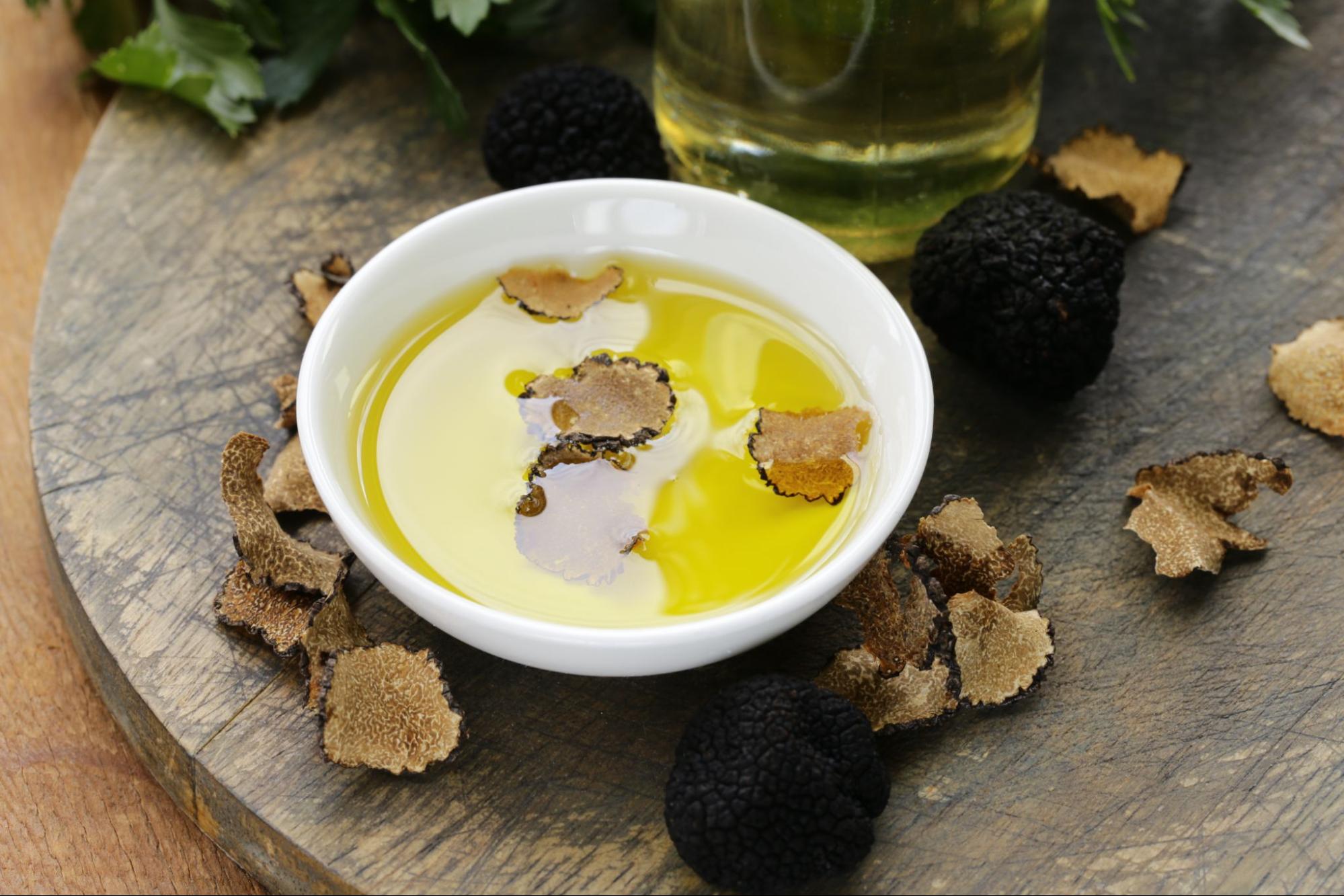 Istrian olive oil with truffles in a white bowl Istrian olive oil with truffles in a white bowl