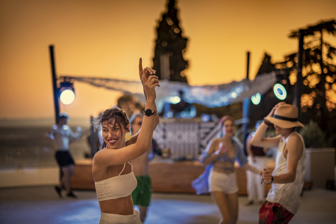 Summer evening party by the sea with dancing and music Summer evening party by the sea with dancing and music