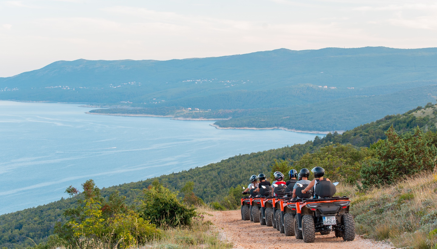 Quad biking with kids through forests and along the coast in Rabac