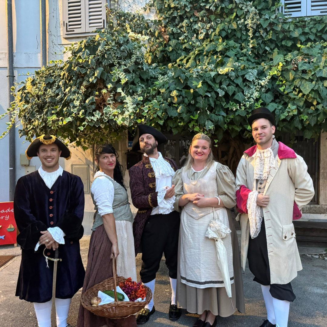 The Casanova Tour cast brings history and legend to life with charm and humour. Cast of the Casanova Tour in Vrsar dressed in period costumes posing together outdoors.