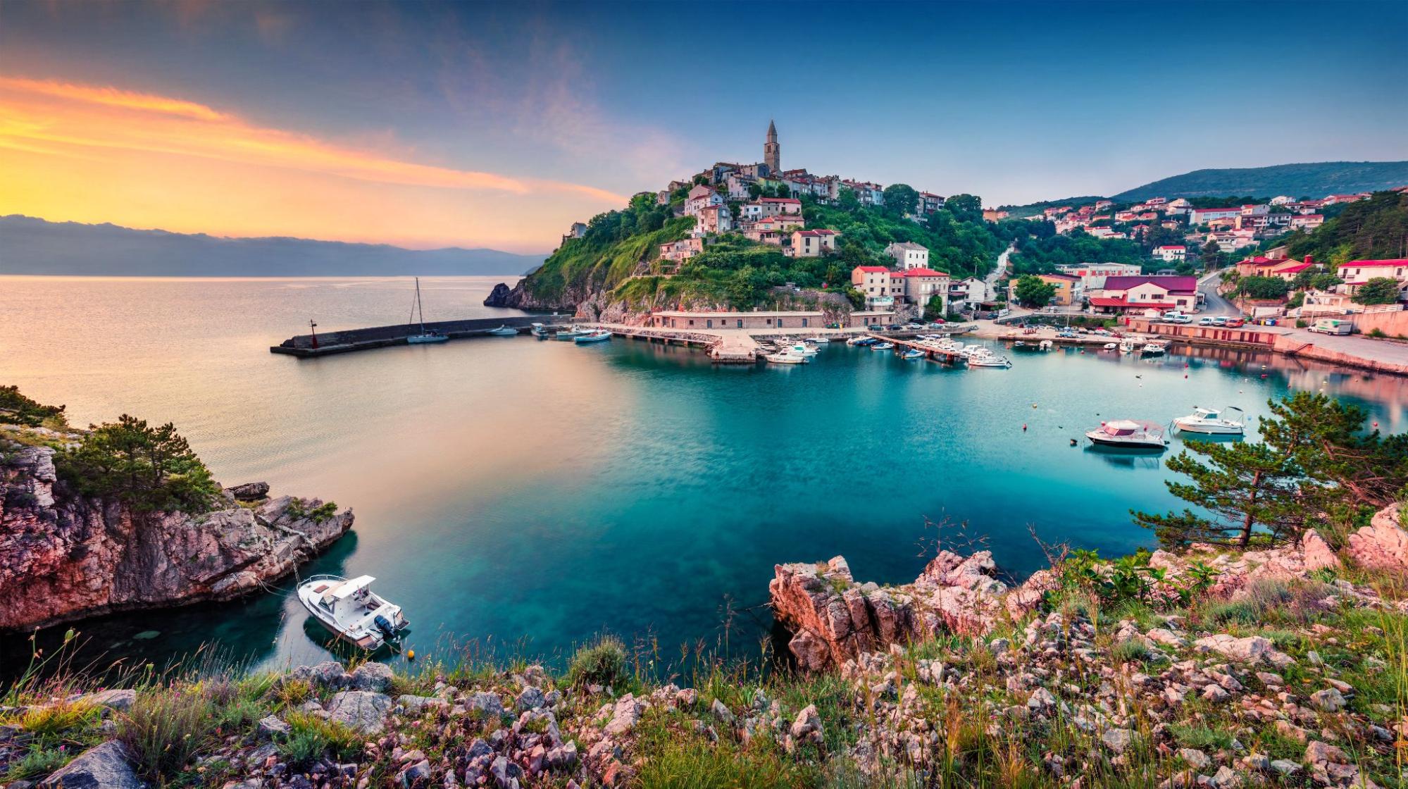 View of Vrbnik, a Mediterranean village perched on a cliff above the sea