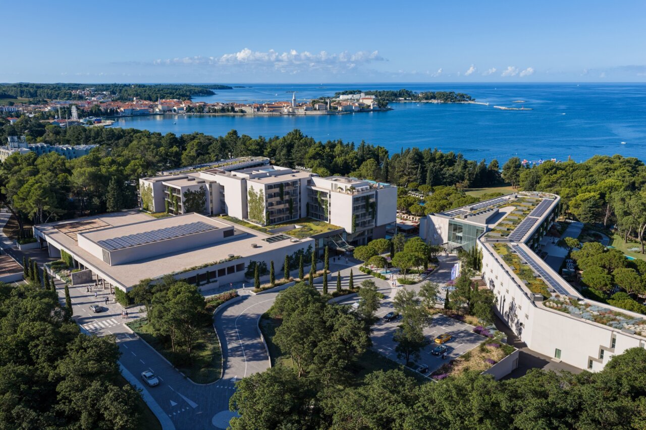 Aerial view of Pical Resort, Valamar Collection, nestled in pine forest, overlooking the bay and Poreč old town.