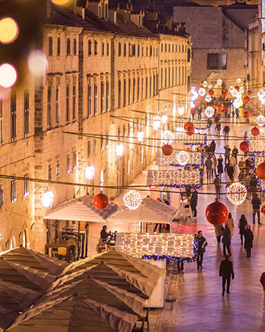 Dubrovnik Old Town illuminated during Advent with Christmas lights and festive stalls