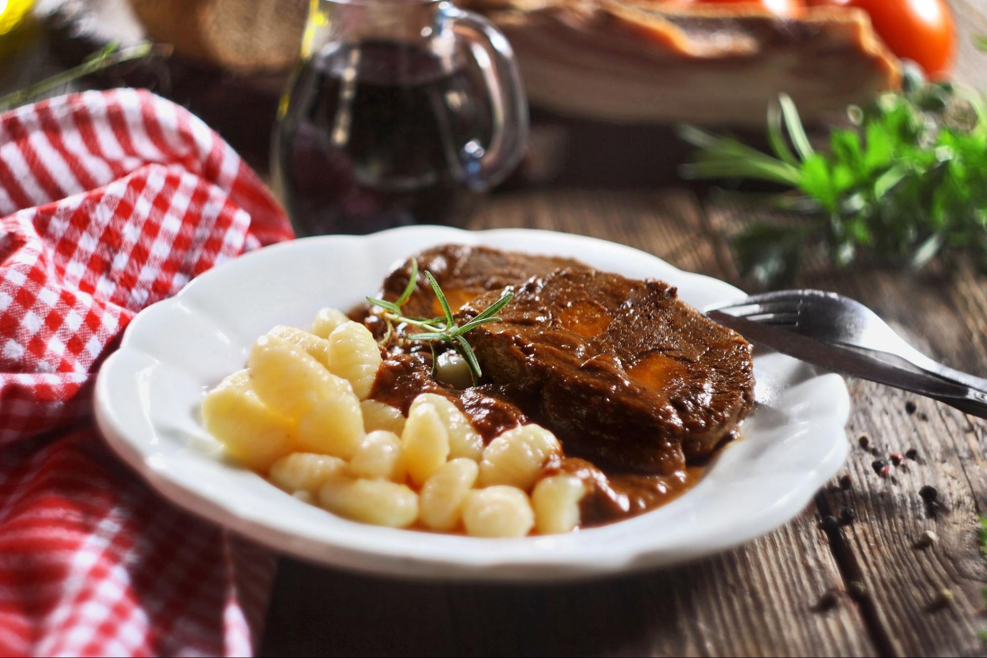 Classic Croatian winter dish - slow-cooked beef pašticada with gnocchi Classic Croatian winter dish - slow-cooked beef pašticada with gnocchi