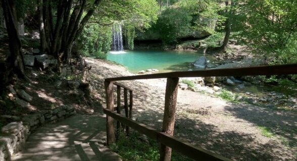 Gologorički Dol waterfall in Istria with turquoise pool and forest path.