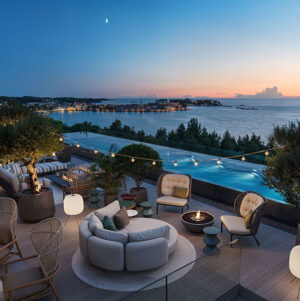Rooftop Bar at Pical with olive trees, fire pits, and an infinity pool overlooking the sea and Poreč at sunset.