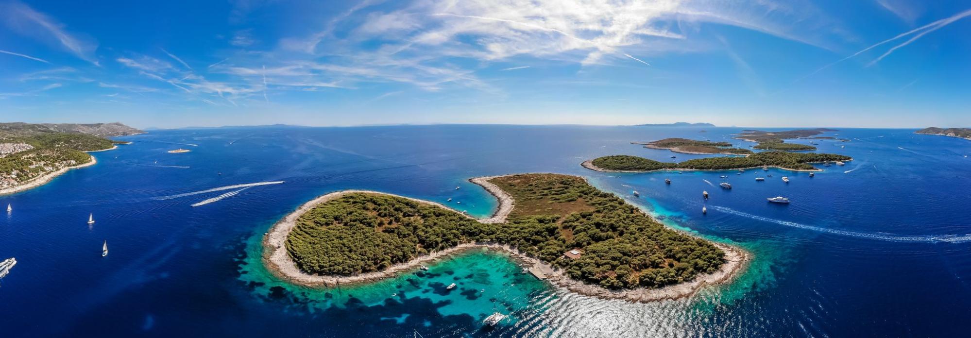 Aerial view of the Pakleni Islands near Hvar in Croatia with turquoise Adriatic Sea and sailing boats Aerial view of the Pakleni Islands near Hvar in Croatia with turquoise Adriatic Sea and sailing boats