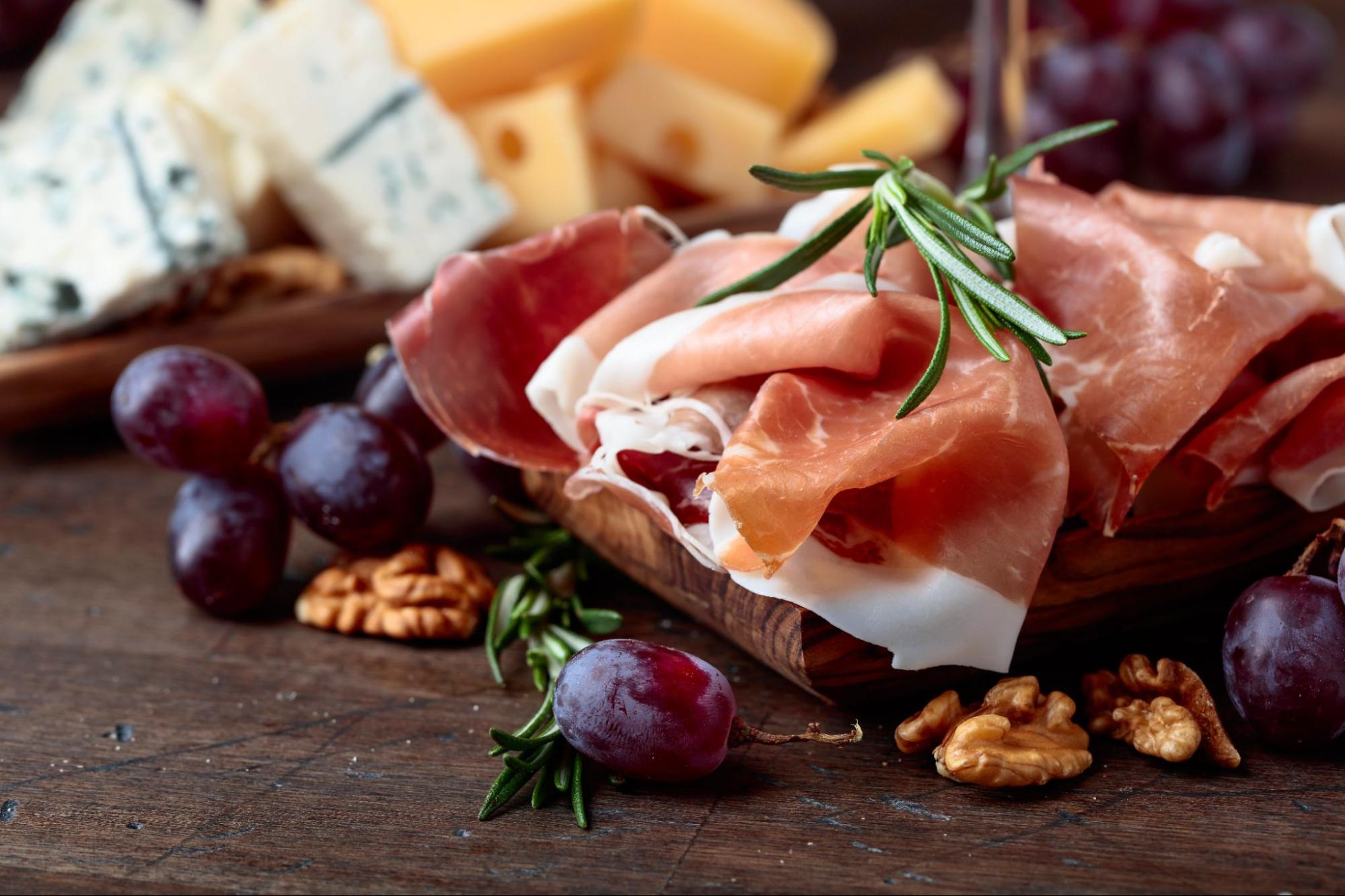 Prosciutto and cheese served on a platter as a traditional Istrian starter