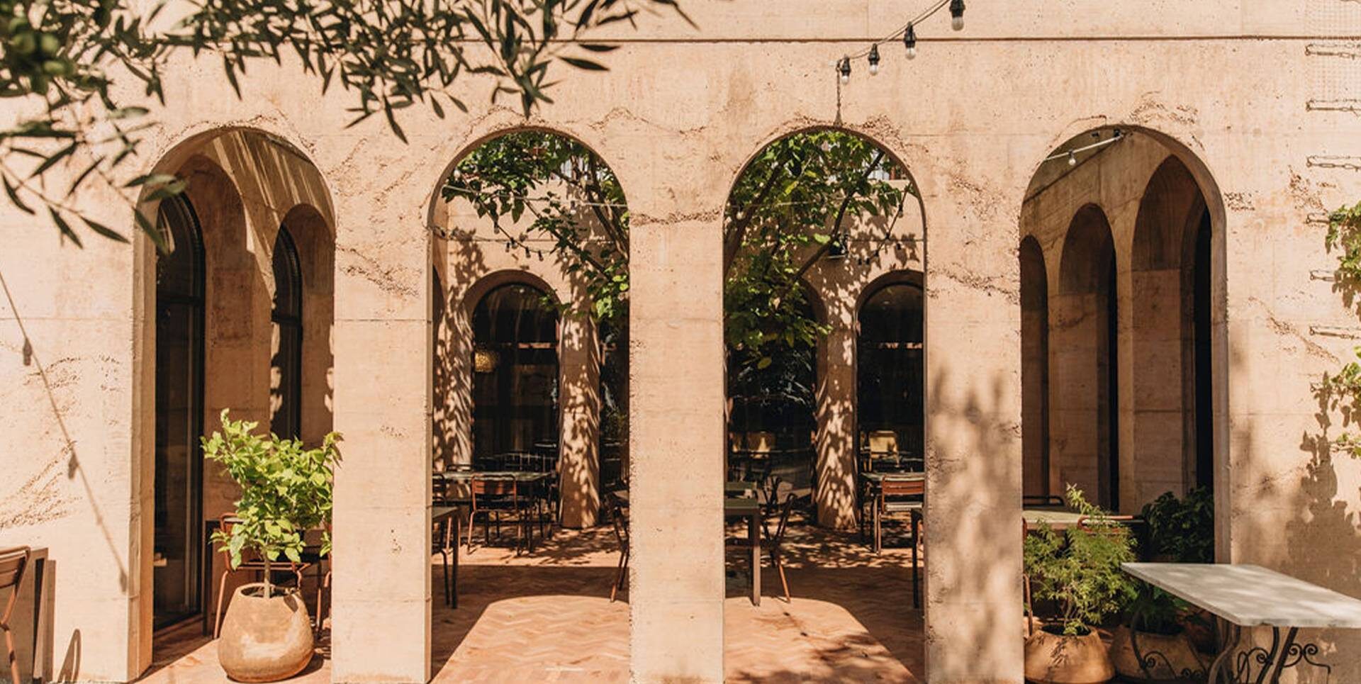Outdoor seating area with rustic details and a Mediterranean atmosphere at Stara &Scaron;kola restaurant in Krasica